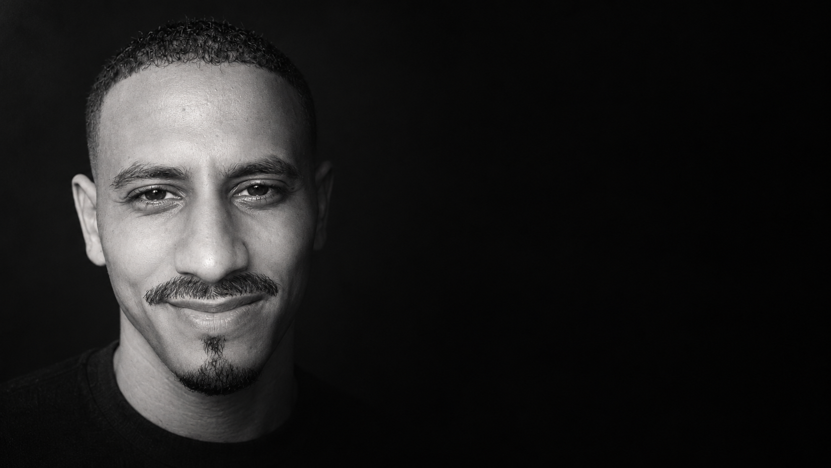 Black-and-white close-up portrait of Mohamed Aachour